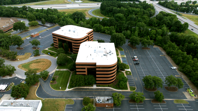 An aerial drone photograph of an office building in Hampton Roads, Virginia