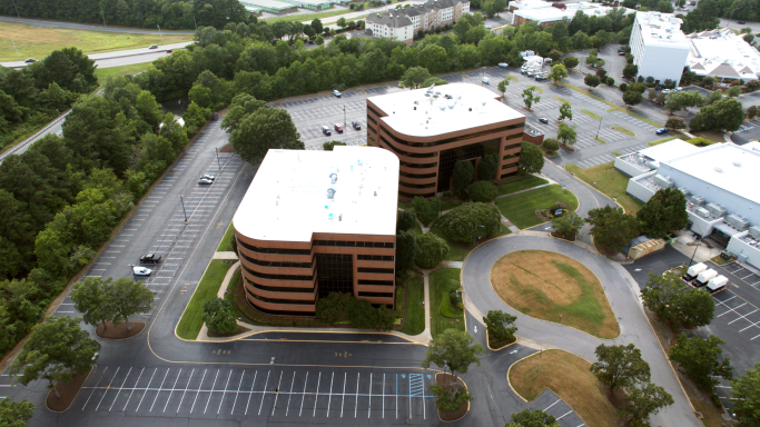 An aerial drone photograph of an office building in Hampton Roads, Virginia