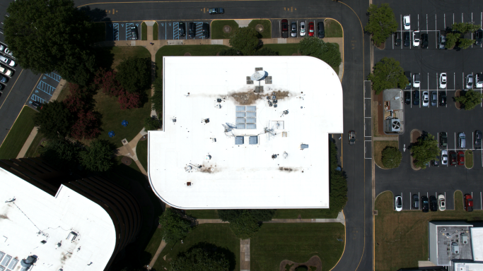 An aerial drone photograph of an office building in Hampton Roads, Virginia