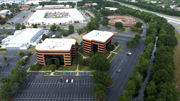 An aerial drone photograph of an office building in Hampton Roads, Virginia