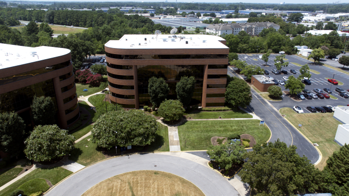 An aerial drone photograph of an office building in Hampton Roads, Virginia