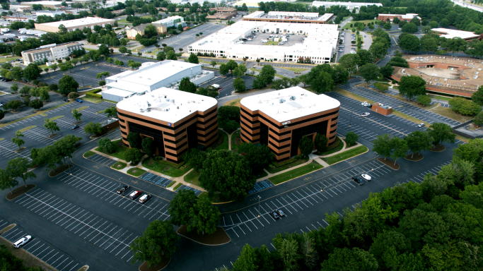 An aerial drone photograph of an office building in Hampton Roads, Virginia